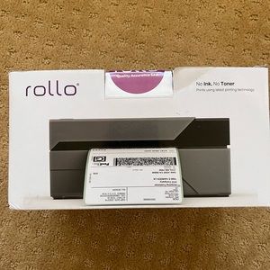 New Rollo printer, comes with shipping labels.